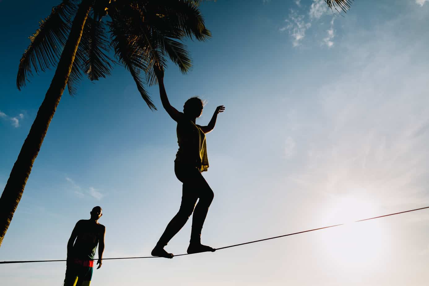 A regular slackline set up between two trees.